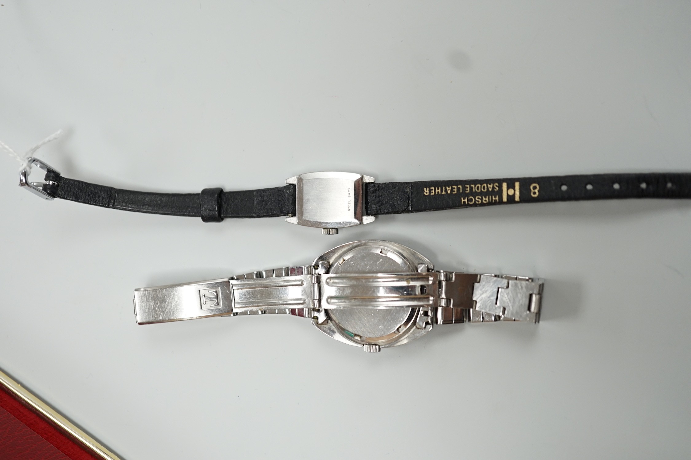 A lady's stainless steel Omega manual wind wrist watch, case diameter 16mm, with Omega box and a similar Tissot wrist watch.